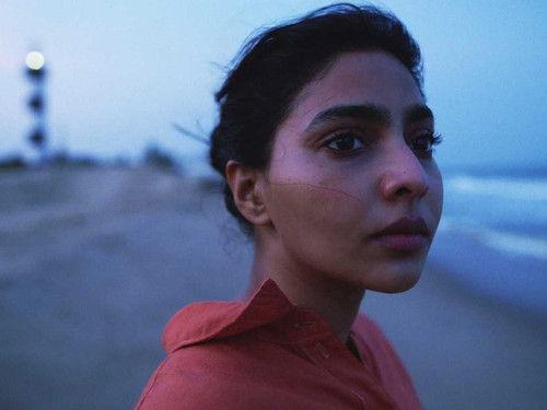 Background image for Nizhal Tharum Idham