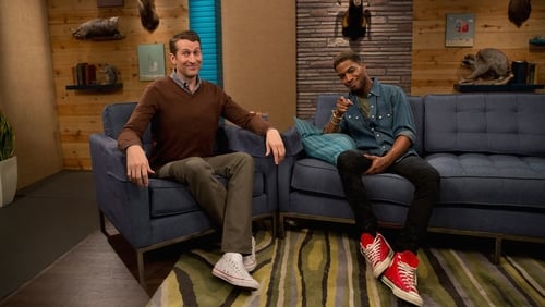 Kid Cudi Wears a Denim Shirt and Red Sneakers