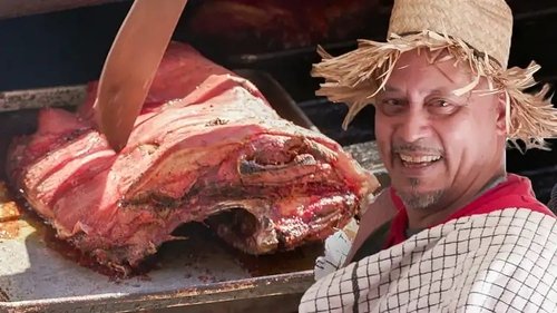 Background image for The Lechón King of the South Bronx