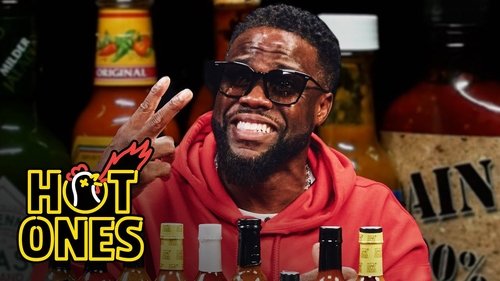 Background image for Kevin Hart Celebrates 10 Years of Hot Ones While Eating Spicy Wings