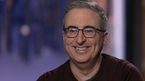 Background image for The Justice Department; CFPB; John Oliver