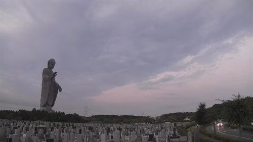 In a Cemetery Looking Up at the Great Buddha still